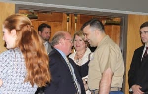 Gentry Locke attorneys Greg Haley, Monica Monday, and Andrew Bowman congratulate Major John Thomas, USMC